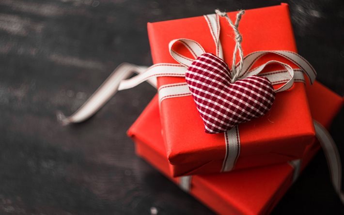 Il giorno di san valentino, un regalo, un cuore viola, rosso scatola regalo