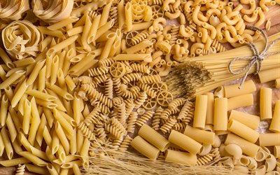 olika pasta, spaghetti, bakgrund med olika pasta, olika pastakoncept, matbakgrund