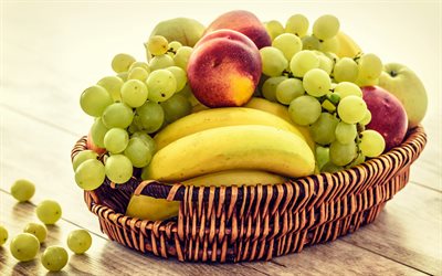 cesta de frutas, bananas, uvas, p&#234;ssegos, vitaminas, frutas maduras