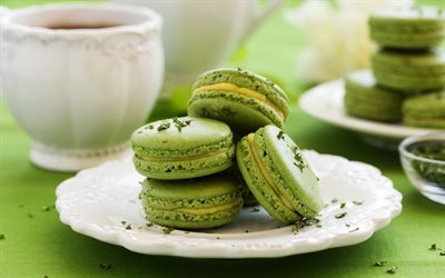 green macaroons, green cookies, macaroons, pastries, macarons on a plate, cakes
