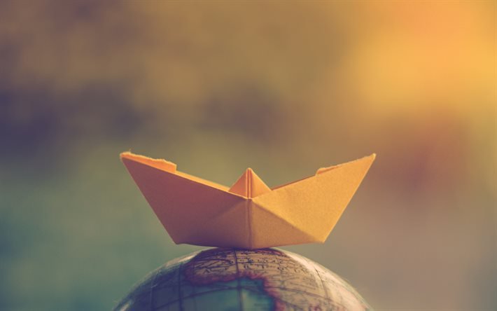 barco de papel no globo, conceitos de viagens, conceitos de turismo, barco de papel, viagens ao redor do mundo