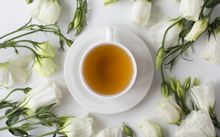 flower tea, green tea, white cup with tea, white roses, tea concepts