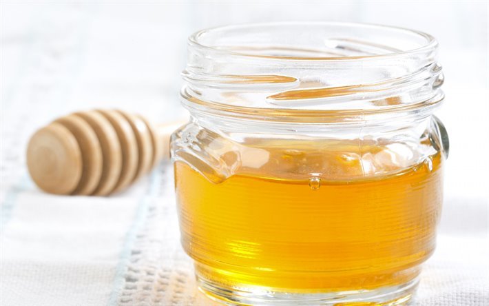 du miel, des bonbons, un pot de miel, le b&#226;ton de bois pour la production de miel, pot en verre