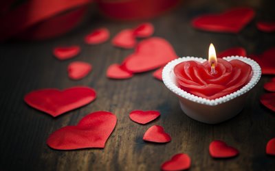 Valentines Day, red satin hearts, burning candle, romance, love concepts, candle heart