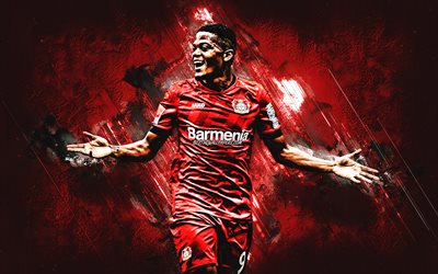 Leon Bailey, Bayer 04 Leverkusen, Jamaican football player, portrait, red stone background, football, Bundesliga, Germany