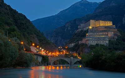 Valle dAosta, medieval castle, evening, old fortress, old bridge, city lights, mountains, Italy