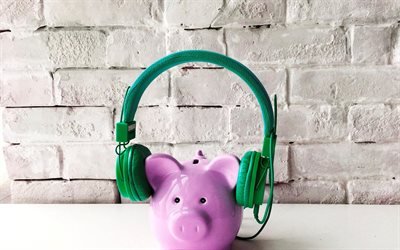 pink piggy bank, green headphones, investment concepts, finance, deposits