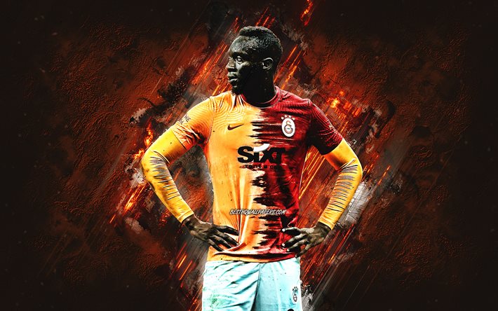 Mbaye Diagne, Galatasaray, Senegalese footballer, portrait, orange stone background, soccer