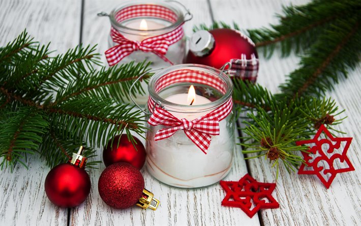 Red christmas balls, candle in a glass jar, Happy New Year, Christmas background, red Christmas stars, decoration, Christmas
