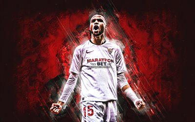 Youssef En Nesyri, Sevilla FC, marokkolainen jalkapalloilija, muotokuva, punainen kivitausta, jalkapallo