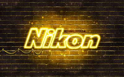 Nikon sarı logo, 4k, sarı brickwall, Nikon logo, marka, logo, neon, Nikon