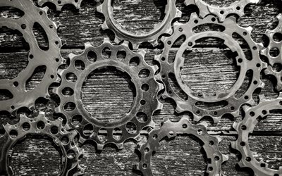 iron gears on a wooden background, mechanism concepts, gearwheels, iron gears