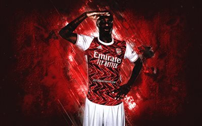 Nicolas Pepe, Arsenal FC, futbolista marfile&#241;o, retrato, fondo de piedra roja, f&#250;tbol