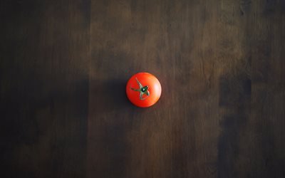 einsamkeitskonzepte, tomate auf dem tisch, dunkle holzstruktur, einsamkeit