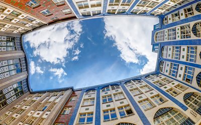 Berlin, blue sky, bottom view, white clouds, old houses, Germany