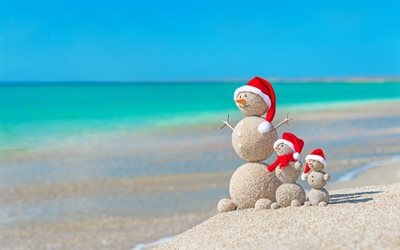 Christmas, tropical islands, beach, snowmen from the sand, New Year, sandy snowmen