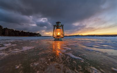 lamp on the lake, frozen lake, winter, light concepts, winter evening, snow