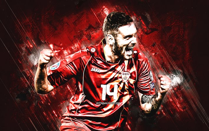 リュプチョ・ドリエフ, 北マケドニア代表サッカーチーム, マケドニアのサッカー選手, 縦向き, 赤い石の背景, フットボール。