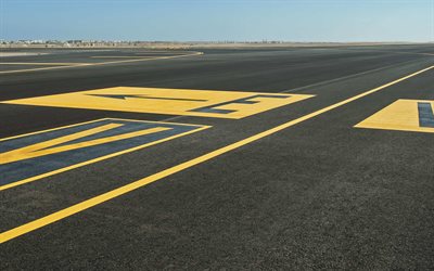 airport, runway, arrows on the asphalt, yellow pointers, aircraft