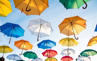 Colorful umbrellas, bright colors, umbrellas in the sky, blue sky