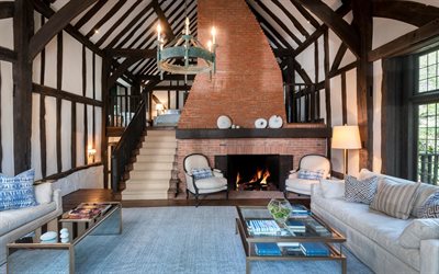 country house, living room, interior design, red brick fireplace, wood beams on the ceiling