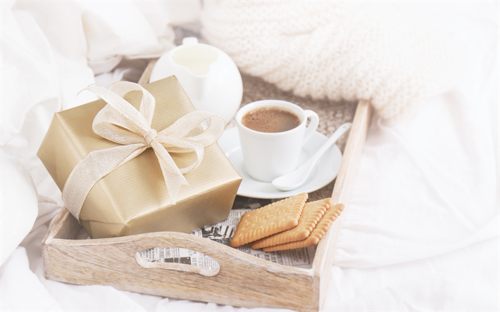 Romance, breakfast in bed, cup of coffee, gift box, cookies, breakfast