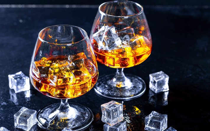 brandy with ice, ice cubes, brandy glasses, cognac, brandy, glasses on the table