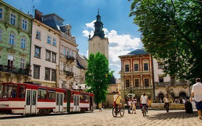 tram, spire of town hall, lions, market square, ukraine