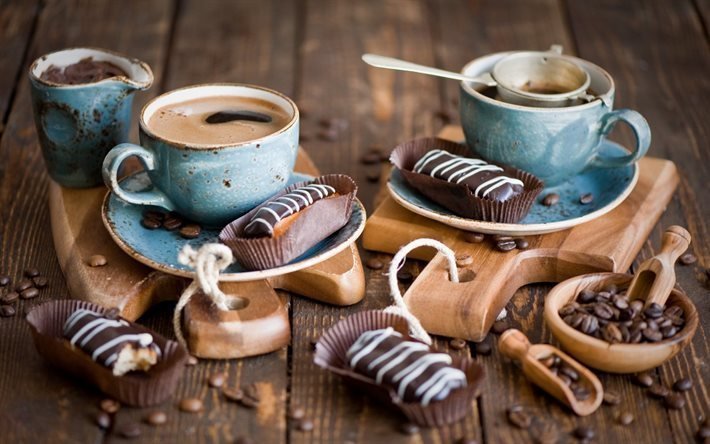 chocolate eclairs, coffee beans, cup