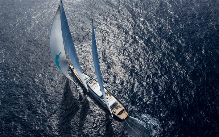modern sailer, sea, white sails, top view, waves, yacht ride concepts