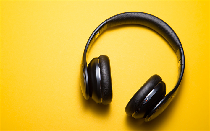 fones de ouvido, conceitos de m&#250;sica, fones de ouvido em um fundo amarelo, 4k