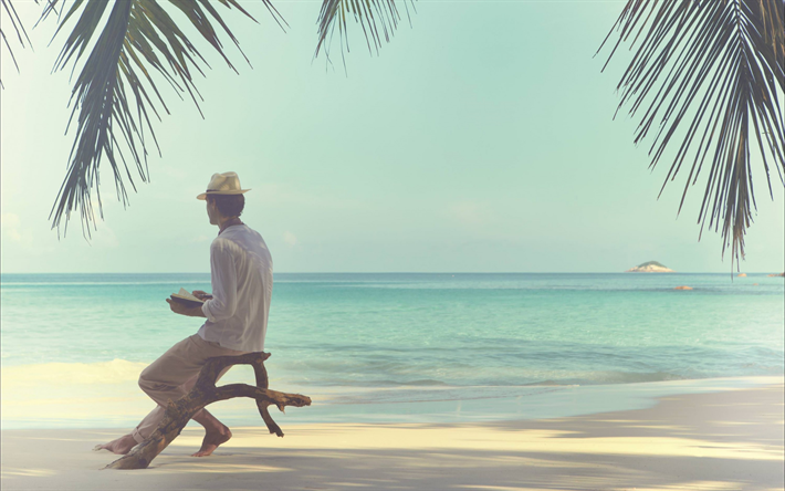 Tropical islands, travel, concepts, ocean, summer vacation, a man on the beach