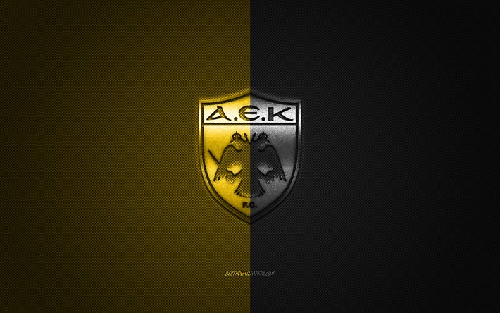 El AEK Athens FC, griego club de f&#250;tbol de la S&#250;per Liga de Grecia, el negro y el logo amarillo, negro y amarillo de fibra de carbono de fondo, f&#250;tbol, Atenas, Grecia, el AEK Athens FC logo