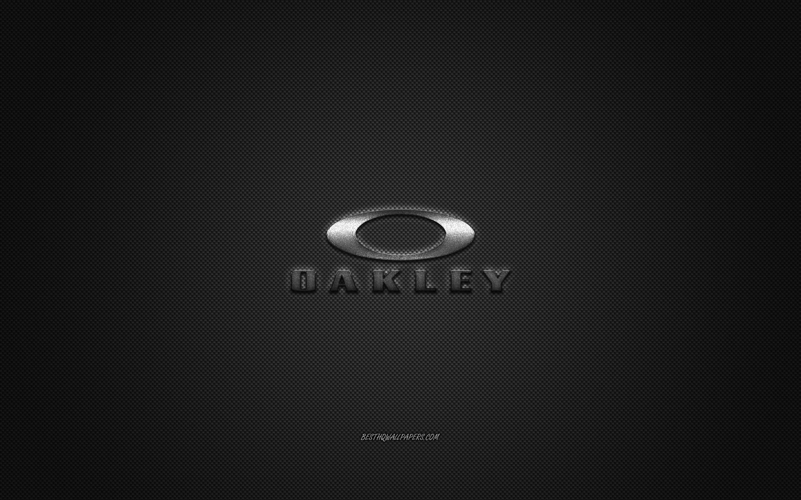ダウンロード画像 Oakleyロゴ 金属エンブレム アパレルブランド ブラックカーボンの質感 グローバルアパレルブランド Oakley ファッションの概念 Oakleyエンブレム 画面の解像度 2560x1600 壁紙デスクトップ上
