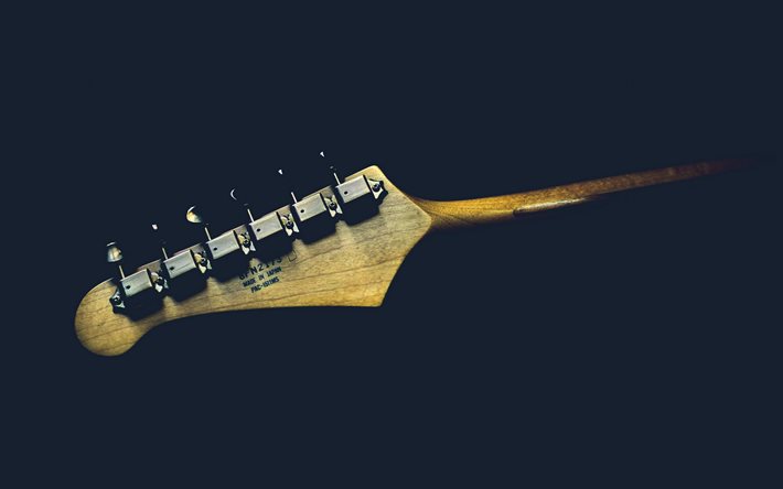 la guitarra en el cuello, fondo negro, guitarra, tocar la guitarra conceptos, de madera de la guitarra