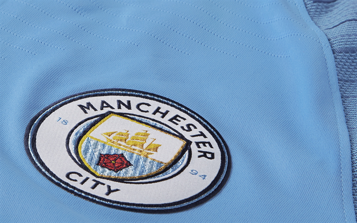 Il Manchester City FC, logo, stemma, il club di calcio inglese, la Premier League, in Inghilterra, in uniforme blu