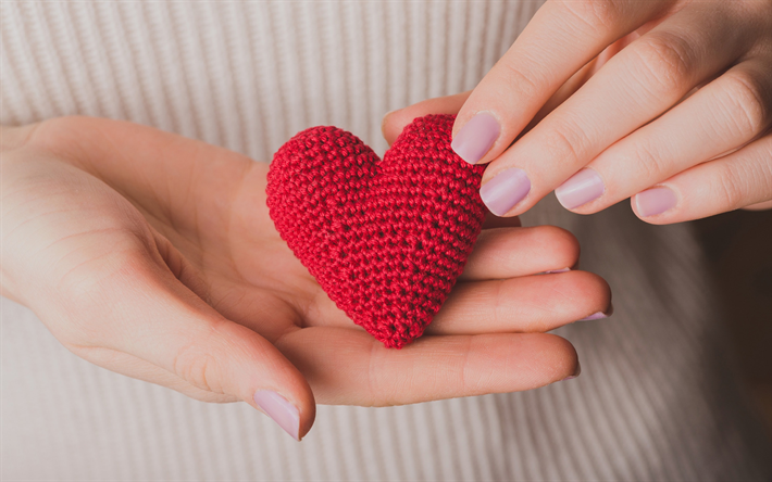 red heart in hands, knitted red heart, love concepts, romance, heart in female hands