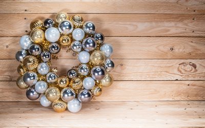 Christmas wreath, New Year, light wooden background, creative wreath, golden balls, silver balls, wreath from Christmas balls