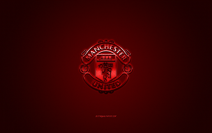 Le Manchester United FC, club de football anglais, rouge m&#233;tallis&#233; logo rouge en fibre de carbone de fond, de Manchester, en Angleterre, Premier League, football