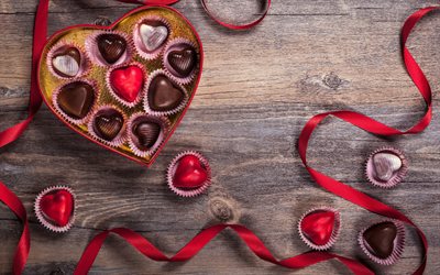 La saint valentin, cadeaux, bonbons au chocolat, cœur, rouge, ruban de soie, l&#39;amour des concepts