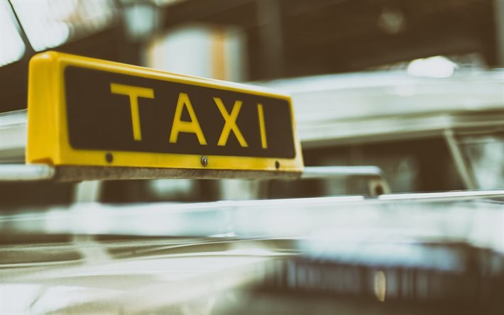 Taxi, gult taxitecken p&#229; taket, taxitecken, taxikoncept, passagerartransport