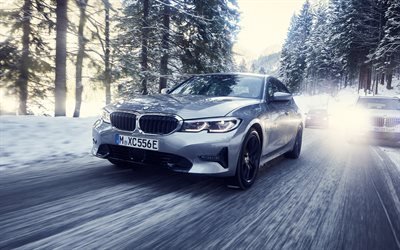BMW 3, 2019, 330e, plug-in hybrid, new silver BMW 3, exterior, riding on a snowy road, riding on ice, BMW