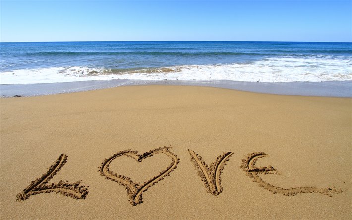 La parola amore nella sabbia, di amore, di concetti, di mare, di costa, le onde