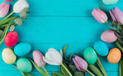 Easter eggs, blue wooden background, Happy Easter, frame with Easter eggs, tulips, spring flowers
