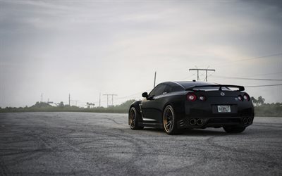 Nissan GT-R, black sports coupe, rear view, cool wheels, tuning GT-R, Japanese sports cars, Nissan