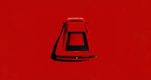 4K Minimalist Red Car Wallpaper