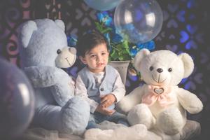A baby boy lying in bed, ready to start the day baby boy wallpaper