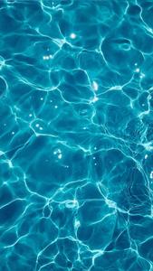 A beautiful blue wave on a peaceful surface. blue aesthetic wallpaper