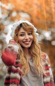A beautiful young girl embracing the autumn season. girl wallpaper