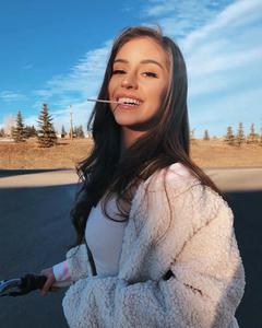 A beautiful young girl enjoying time outdoors aesthetic girl wallpaper